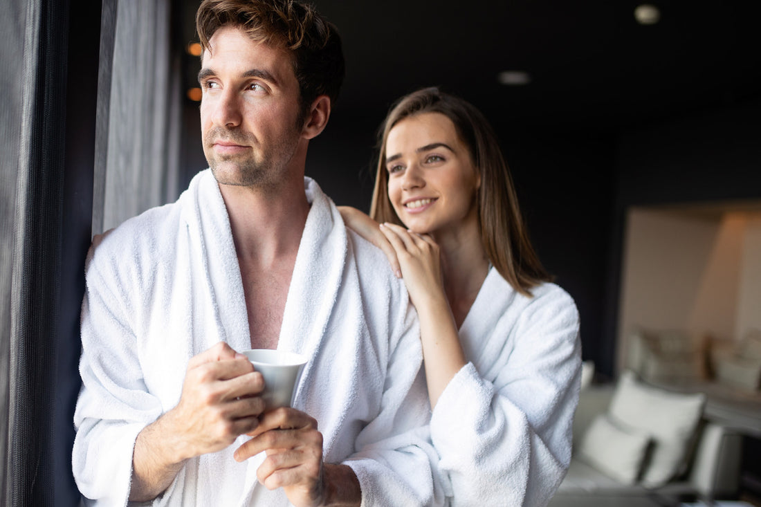 smiling happy couple in bathrobes, what is wellness
